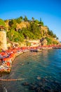 Antalya, Turkey - September 10, 2022: People on the beach near port in old town of Antalya, Turkey Royalty Free Stock Photo