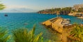 ANTALYA, TURKEY: Ship with tourists sails along the Mediterranean coast on a sunny summer day in Antalya. Royalty Free Stock Photo