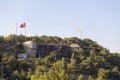 Antalya, Turkey - 03.07.2020: Statue of Mustafa Kemal Ataturk and an artificial waterfall, at the entrance to the city forest, an
