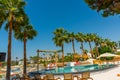 ANTALYA, TURKEY: Swimming pool and swing on the territory of Fosforlu beach on a sunny day. Royalty Free Stock Photo