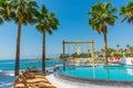 ANTALYA, TURKEY: Swimming pool and swing on the territory of Fosforlu beach on a sunny day. Royalty Free Stock Photo