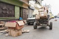 Antananarivo, Madagascar - April 24, 2019: Simple cart with empty carton boxes and wooden boards to setup stall for morning