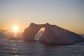 Antarctic iceberg at sunset