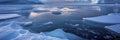 Antarctic landscape with icebergs and ice floes.