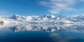 Antarctic seascape with icebergs and reflection