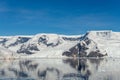 Antarctic seascape with icebergs and reflection