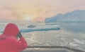 Antarctic tourist watch a leopard seal (Hydrurga leptonyx) very closely from the Zodiac on an ice floe in Cierva Cove