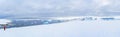 Antarctic tourists in red parkas climb an Antarctic iceberg landscape at Portal Point Antarktika