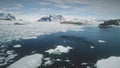 Antarctica aerial flight over swimming penguins.