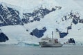 Research vessel Akademik Ioffe on the background of a glacier in Antarctica