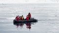 Antarctica, 10 January 2024: A group of researchers on a rubber motorboat sail to the shore in the bay near the