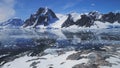 Antarctica ocean, snow mounts. Aerial flight.