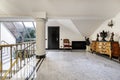 Antechamber next to the stairwell of a luxury home with marble floors and skylight with terrace