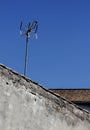 Antena on a roof of an old desolate house