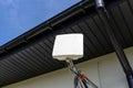 Antenna amplifier for mobile internet at home, mounted on the facade of the house outside. Royalty Free Stock Photo