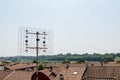 Antenna with parabola, on the roofs that transmits on various frequencies.