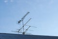 Antenna for receiving television programs on a gray tile roof Royalty Free Stock Photo