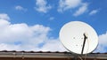 Antenna on the roof surrounded by clouds Royalty Free Stock Photo