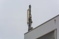 Antenna, telecommunications tower on a roof Royalty Free Stock Photo