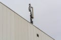 Antenna, telecommunications tower on a roof Royalty Free Stock Photo