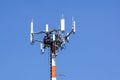 Antenna tower, with the blue sky. Close-up of the Communication antenna building with the sky background. Royalty Free Stock Photo