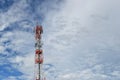 Antenna tower at blue sky and white clouds on a beautiful day. Royalty Free Stock Photo