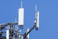 Antenna tower, with the blue sky. Close-up of the Communication antenna building with the sky background. Royalty Free Stock Photo