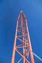 Antenna tower reaching to a clear blue sky