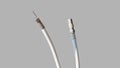 Antenna and TV cord on a gray background. PAL antenna cable, plug, antenna cord, type F, coaxial cable