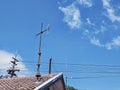 Antenna and Utility Lines on Rooftop Royalty Free Stock Photo