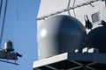 Antennae dome of a grey naval vessel..