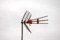 Antennas on a Roof over a Cloudy Sky Royalty Free Stock Photo