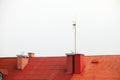 Antenne on red roof white sky Royalty Free Stock Photo