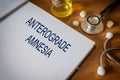 Anterograde amnesia written on book with tablets