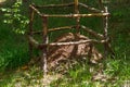An anthill in the forest is surrounded by a fence Royalty Free Stock Photo