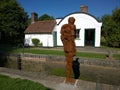 Anthony Gormley sculpture and lock keepers house