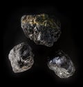An anthracite hard-coal carbon mineral nugget from Donbass, Ukraine. A photo of stone isolated on black. For Geology minerology