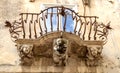 Anthropomorphic Stone figures under the balcony of La Rocca palace. Ragusa Ibla Sicily Italy