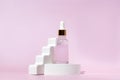 anti-aging collagen facial serum in glass bottle on white podium on pink background with copy space. Natural Organic Cosmetic