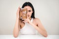 Womanshowing box with quartz facial roller and gua-sha for skin care Royalty Free Stock Photo