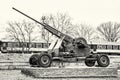 Anti-aircraft machine gun and train in motion, colorless Royalty Free Stock Photo