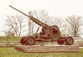 Anti-aircraft machine gun, war industry, yellow photo filter Royalty Free Stock Photo