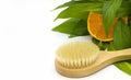 Anti-cellulite massage brush on a white background. Orange peel cellulite concept. Lymphatic drainage massage. Place for text.