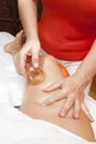 Anti cellulite massage with Ventuza vacuum body puller Royalty Free Stock Photo