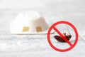 Anti cockroach, pest control concept. Stop insects sign. Cockroach with caution sign, pest control in red forbidding