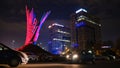 Anti-communist fight monument Wings, two glass office buildings at night, parked cars. Bucharest, Romania. Royalty Free Stock Photo