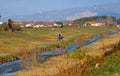 Vicopisano, Pisa, Italy - February 25, 2019: anti-fire helicopter loads water from the river on its bucket Royalty Free Stock Photo