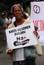 Anti-government protesters holding a banner that reads: Stop us eating garbage