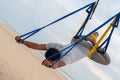 Anti-gravity Yoga, man doing yoga exercises on the sea background Royalty Free Stock Photo