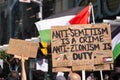 Anti-Israel signs at Pro-Palestine event, Toronto, Ontario